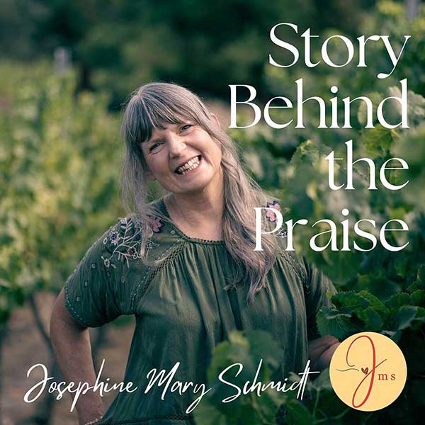 Josephine Mary Schmidt smiling, standing amongst vines in a vineyard