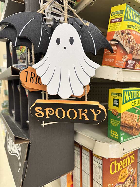 Hanging wooden cute ghost for sale inside Vons Supermarket