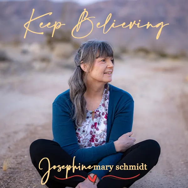 Single artwork for Keep Believing by Josephine Mary Schmidt of artist sitting in the California desert.