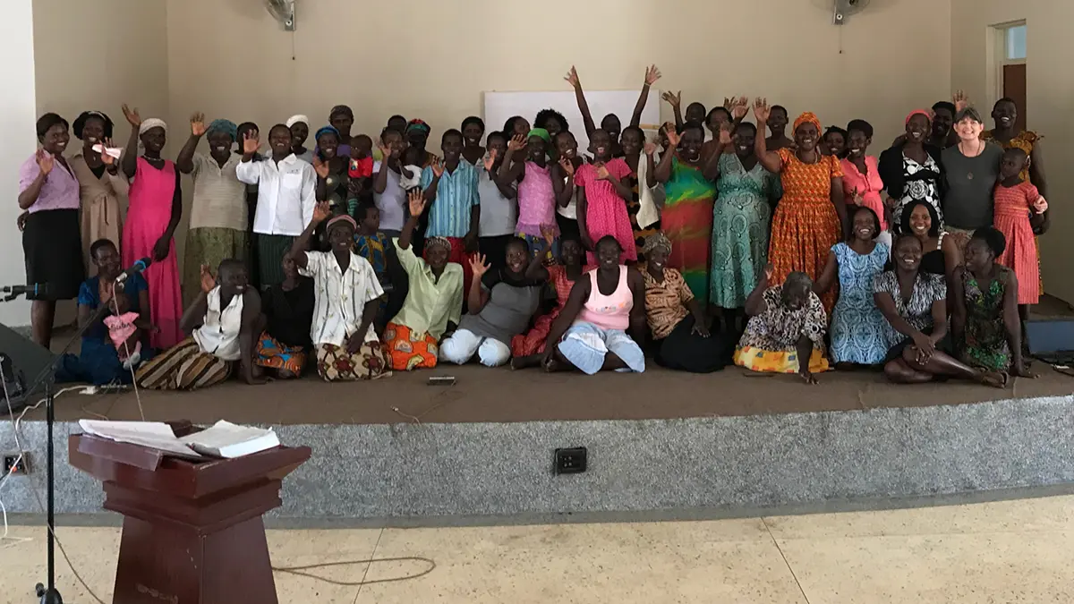 Josephine Mary Schmidt is standing with the large group of women in Soroti, Uganda, whom she taught the book of Colossians.